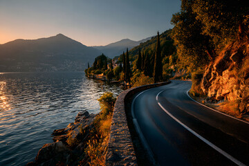 Asphalt road near lake in nature