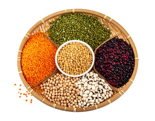 A colorful assortment of various dried beans and legumes arranged in a circular bamboo tray for culinary use