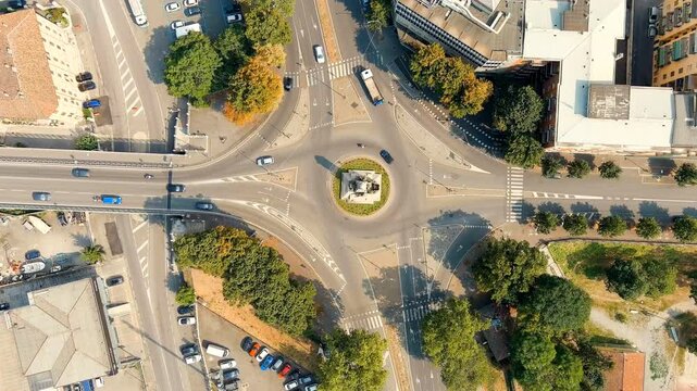 Piacenza, Italy. Piazzale Milano - City square. Historical city center. Summer day. Drone footage, HEAD OVER SHOT