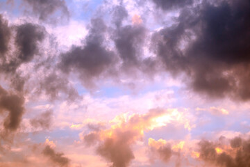 Obraz premium Colorful cloudy sky at sunset. Gradient color purple sky with clouds