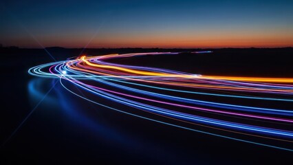 Long exposure shot of colorful light trails curving across a dark, reflective surface