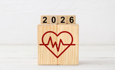 Red Heartbeat Health Icon on Wooden Blocks with 2026 Year Display
