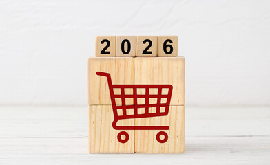 Red Shopping Cart Icon on Wooden Blocks with 2026 Year Display