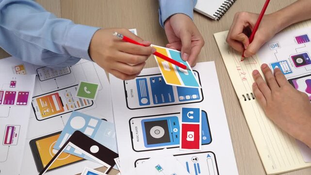 Top view panorama video of startup company employee planning on user interface prototype for mobile application or website in office. UX UI designer brainstorm user friendly interface plan. Synergic
