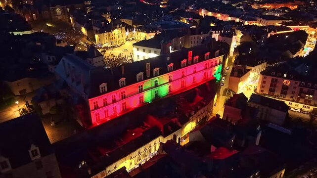 Panoramic drone fly of beautifully illuminated New Castle aka Chateau Neuf with Place de Tr&eacute;moille in Christmas mood, Laval, Mayenne, France