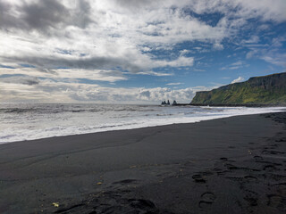 Reynisdrangar sea stacks and black sand beach in South Iceland