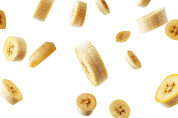 Floating slices of fresh banana against a clean white background. their color and texture. ideal for health-related content or culinary presentations