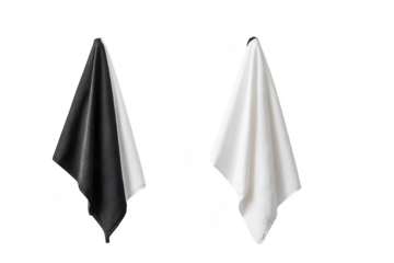 A minimalist interior scene featuring two hanging towels. one black and one white. neatly displayed on a light-colored wall. evoking a clean and modern aesthetic suitable for home decor