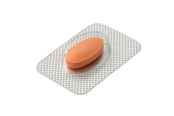 Obraz premium Orange oval pill in a transparent blister pack, representing medicine, healthcare, and pharmacy