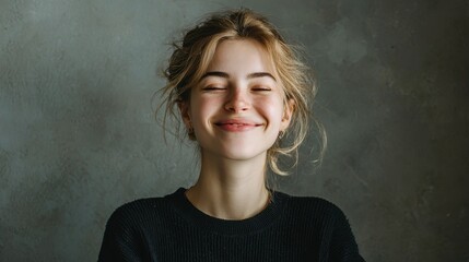 Fototapeta premium Young woman displays calm and joyful smile, promoting emotional stability and mental health in a serene indoor setting