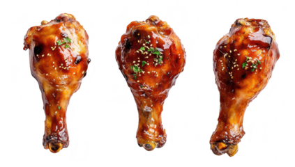 A close-up view of three glazed chicken drumsticks garnished with herbs. their appetizing texture and shine. perfect for culinary presentations or food-related content