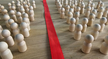 Wooden figures represent division during a workshop or meeting on conflict resolution at a community center concept