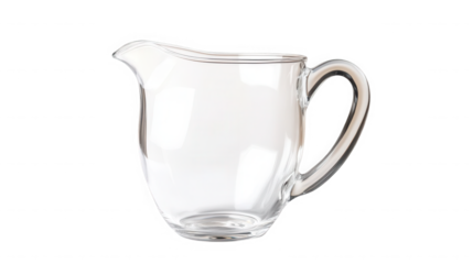 A clear glass creamer pitcher with a handle and spout isolated on a black background in studio shot on transparent background