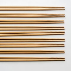 Obraz premium Arrangement of Multiple Bamboo Chopsticks on a Seamless White Surface