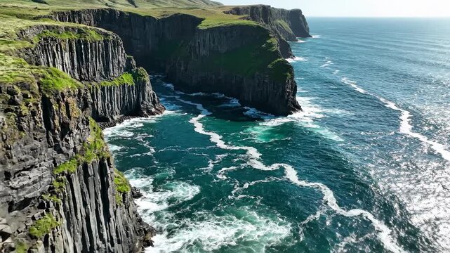 Dramatic coastal cliffs meet the ocean, lush green vegetation on top.