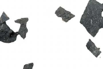 A close-up view of a textured asphalt surface featuring patches of different materials and colors. suggesting recent roadwork or repairs. ideal for urban planning or construction themes