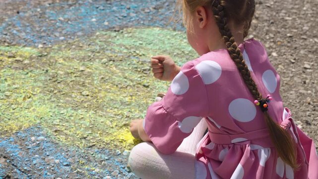 child hand drawing chalk asphalt, child kid childhood dream, little artist playground park girl daughter, artistic kid outside, imaginative play outside, casual creative art, kid chalk creativity