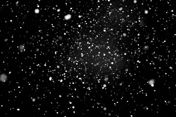 Obraz premium Black background with white specks, mimicking snowflakes, creating an atmospheric effect