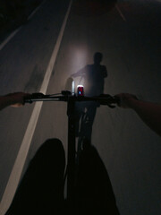 First-Person View of Cyclist Riding at Night