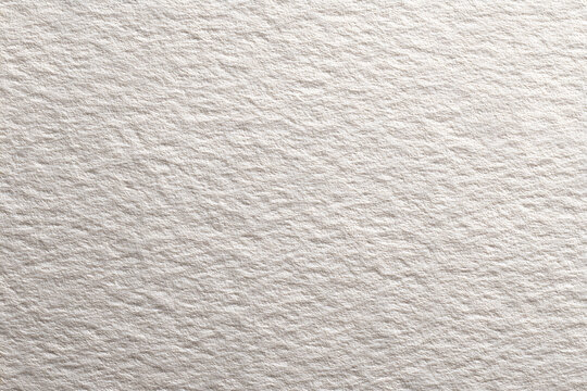 Clean white cardstock paper texture closeup. Smooth bright drawing sheet background for mockup.