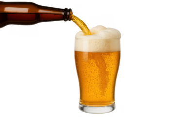 Golden beer pouring from bottle into glass with froth, refreshing alcoholic beverage on transparent background