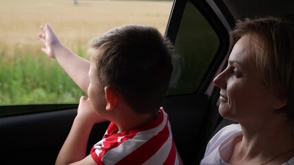 Roadside scenery fascination, Family travel photo, Gentle moments while traveling, Journey through the lens, Side window dreams, Parental affection, Traveling with a child, New experiences through a