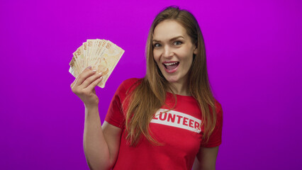 Woman proudly holds fan of turkish lira banknotes and laughs with thumb raised in studio; generosity joy.