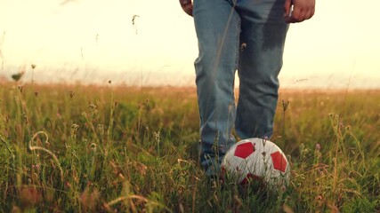 People nature, child kid kicking soccer ball sunset, child playing ball lawn outdoors, playground park, schoolboy playing, summer field game, warm light, slow living, simple outdoor joy. country - Powered by Adobe