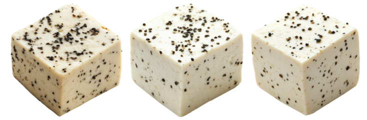 Cubes of seasoned tofu with visible herbs and spices, arranged in stack isolated on white transparent background