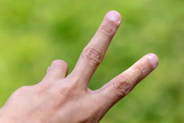 Hand gesture showing two fingers