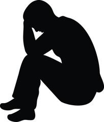 A solitary silhouette of a person sitting with their head in hands