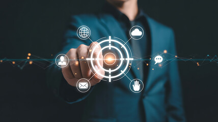 A businessman points to a target icon, symbolizing business goals and marketing strategies success