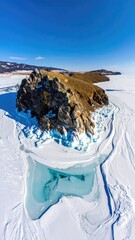Aerial of a rocky islet in winter