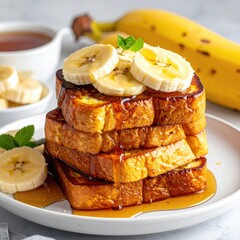 Stacked French toast topped with banana