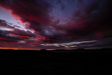 Sunrise scenery over lake Myvatn with mountains and clouds in the sky - Iceland