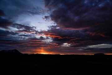 Sunrise scenery over lake Myvatn with mountains and clouds in the sky - Iceland