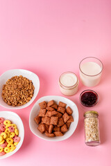 Dry breakfast and milk. Dry sweet breakfast - corn rings, chocolate corn pillows and granola, milk,...