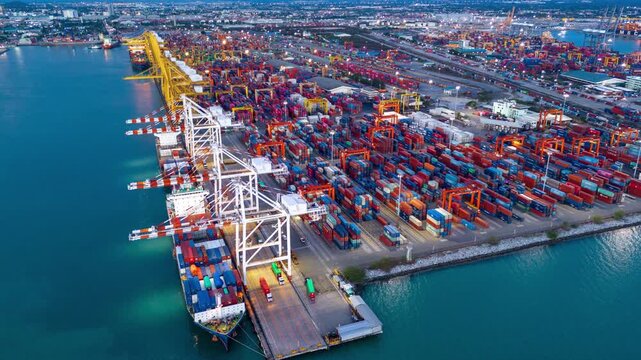 Timelapse unloading Cargo container box to Trucks in Shipyard Cargo Container Sea Port Freight forwarding service logistics and transportation. International Shipping Depot Custom Port import export