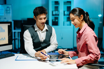 Professional coworkers discussing data and analyzing business reports in a modern office of teamwork, strategy, and corporate collaboration.
