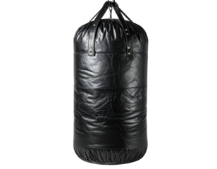 Leather punching bag hangs against dark background