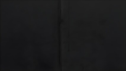 A close up shot of a dark surface with a vertical line running through the center of the frame