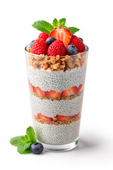Healthy chia seed pudding with fresh strawberries, blueberries, granola and mint leaves in a glass. Layered superfood breakfast parfait for diet and vegan nutrition concepts.