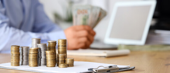 Fototapeta premium Money on table of businessman in office