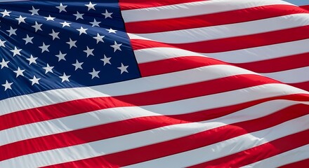 Waving national flag with stars and stripes blows in the wind.