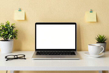 Laptop computer sitting on top of a white desk.