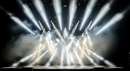 Stage lights create a dramatic scene with beams piercing smoke.