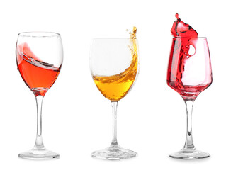 Set of glasses with splashing wine on white background