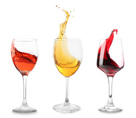 Set of glasses with splashing wine on white background