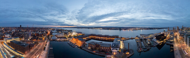Fototapeta premium Aerial panorama of Pier Head at night, Liverpool, Merseyside, England