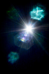Abstract imitation sun starlight distant galaxy on a black background. © filins